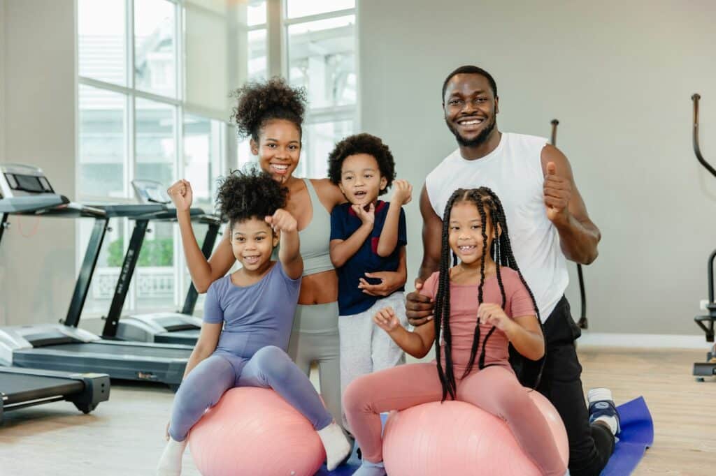 A happy family in Calgary who are enrolled in NutriPOM's Family Coaching Program which is a part of their Holistic Nutrition Programs.